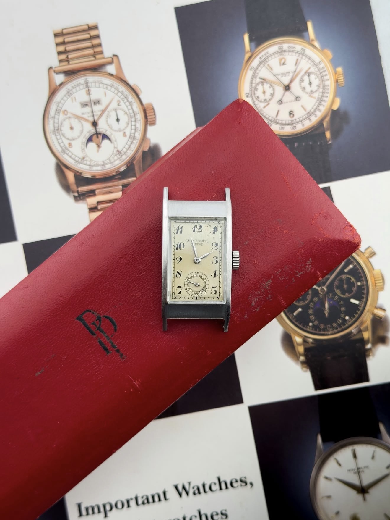Vintage Patek Philippe rectangular dress watch on red Patek pouch